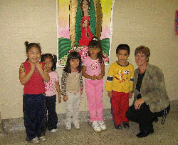 St. Philip Neri preschool students, from left, Nayeli Torres, Betzaida Guillen, Ana Leon, Evelin Romero and Arturo Pena enjoy the refurbished look at their school along with Terri Rodriguez, principal at St. Philip Neri and Holy Cross Central schools in Indianapolis. (Submitted photo) 