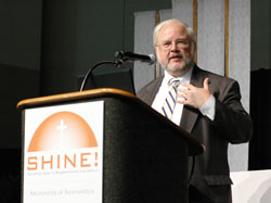 John Carr, executive director of justice, peace and human development for the U.S. Conference of Catholic Bishops addresses participants at the “Spreading Hope in Neighborhoods Everywhere” conference on Oct. 1 in Indianapolis. He challenged archdiocesan Catholics to embrace the social ministry and mission of the Church. (Photo by Mary Ann Wyand)