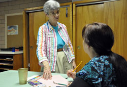 Benedictine Sister Carol Falkner, administrator of the Benedict Inn Retreat and Conference Center in Beech Grove, discusses a future art program with Dema Newby, marketing coordinator, on May 18 in the center’s art room. The staff focuses on creating spiritual retreats that are interesting, helpful, fun, relaxing and energizing experiences. (Photo by Mary Ann Wyand)