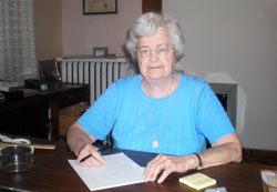 Cecelia “Cel” Lundstrom sits at a desk in the now vacant Birthright facility in Terre Haute. The pro-life ministry closed in October after serving Vigo County residents for 37 years. (Photo by Mike Krokos)