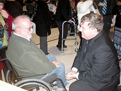 Archbishop Joseph Tobin speaks with Gilbert Marsh, a member of St. Agnes Parish in Nashville, after a Jan. 31 Bloomington Deanery Mass at St. John the Apostle Parish in Bloomington. (Photo by Mike Krokos)