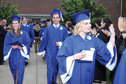 Emma O’Brien, left, Nick Rivelli and Shelby Robertson are all smiles after the graduation ceremony at Bishop Chatard High School in Indianapolis on May 20, 2016. (Photo courtesy of Tiffany Photography Studio)