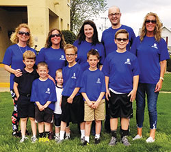 Hoping to promote vocations in the Church in central and southern Indiana, participants from all generations joined in the Race for Vocations as part of the OneAmerica 500 Festival Mini-Marathon and 5K in Indianapolis on May 5. In the front row of this photo, participants included Daniel Oyerbides, left, and Harrison, Rex, Charlie, Lincoln and Nicholas Fischer. In the back row are Mandy Oyerbides, left, Brooke Fischer, Amy Johnson, Father Michael Keucher and Celeste Fischer. (Submitted photo)