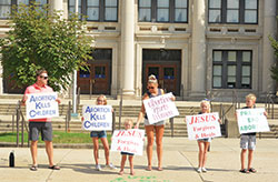 Denis, Ava, Raelyn, Buffy, Tessa and Carter O’Brien, members of St. Jude Parish in Indianapolis, give witness as a family along North Meridian Street in Indianapolis during the national LifeChain event on Oct. 7, 2018. (Criterion file photo by Natalie Hoefer)