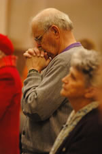 People praying in pews